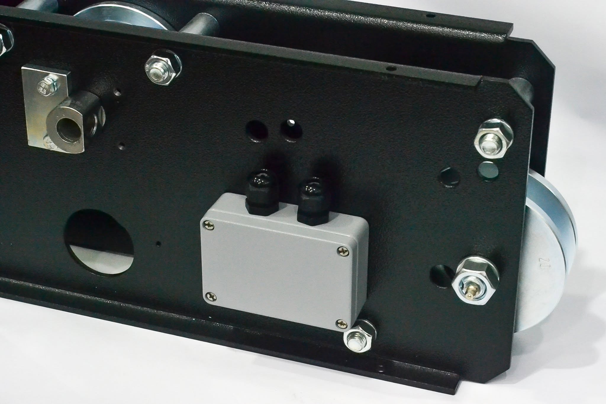 Close-up of a fabricated three-sheave lifting-system assembly